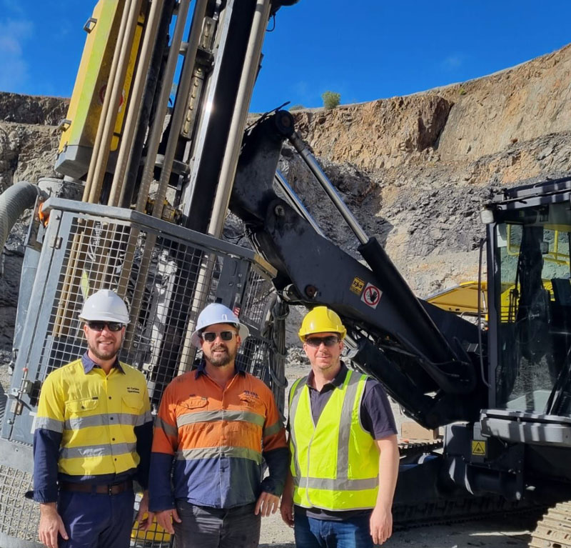 people in front of drilling machine